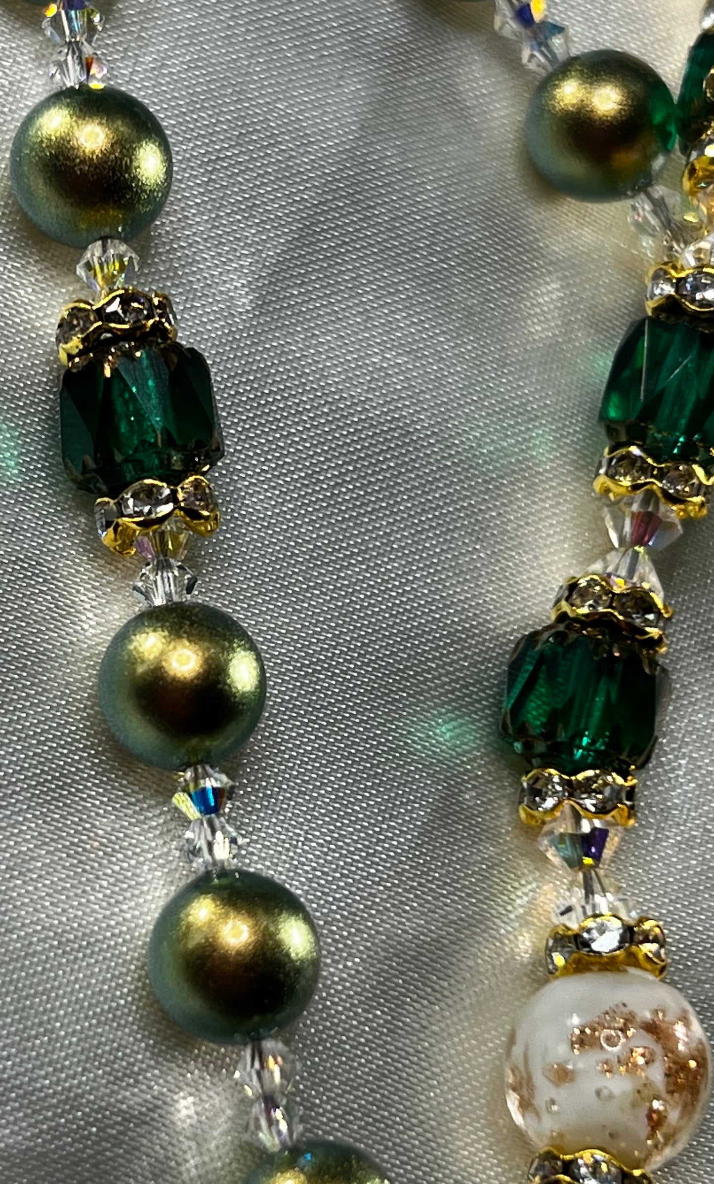 Beautiful Iridescent Green Swarovski Pearl beads, with Emerald Green Cathedral beads & Swarovski Crystal spacers.