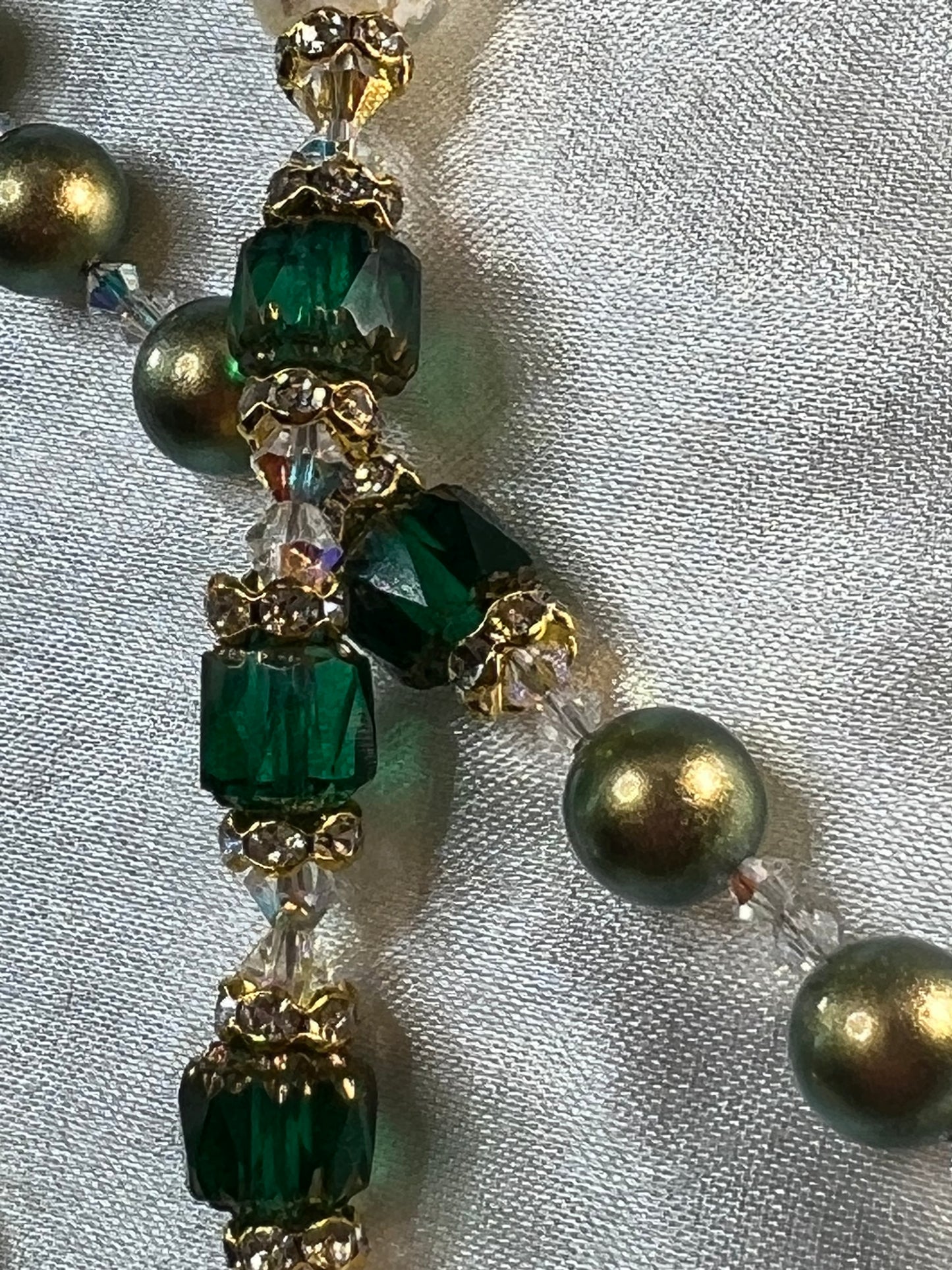 Iridescent Green Swarovski Pearls with Emerald Green Cathedral Pater beads & Swarovski Crystal spacers.