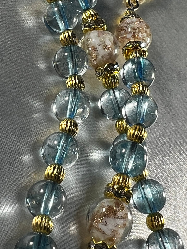 Iridescent Blue Glass beads, Gold Metal Spacers, Rhinestone spacers & Glow in the Dark Pater Beads.