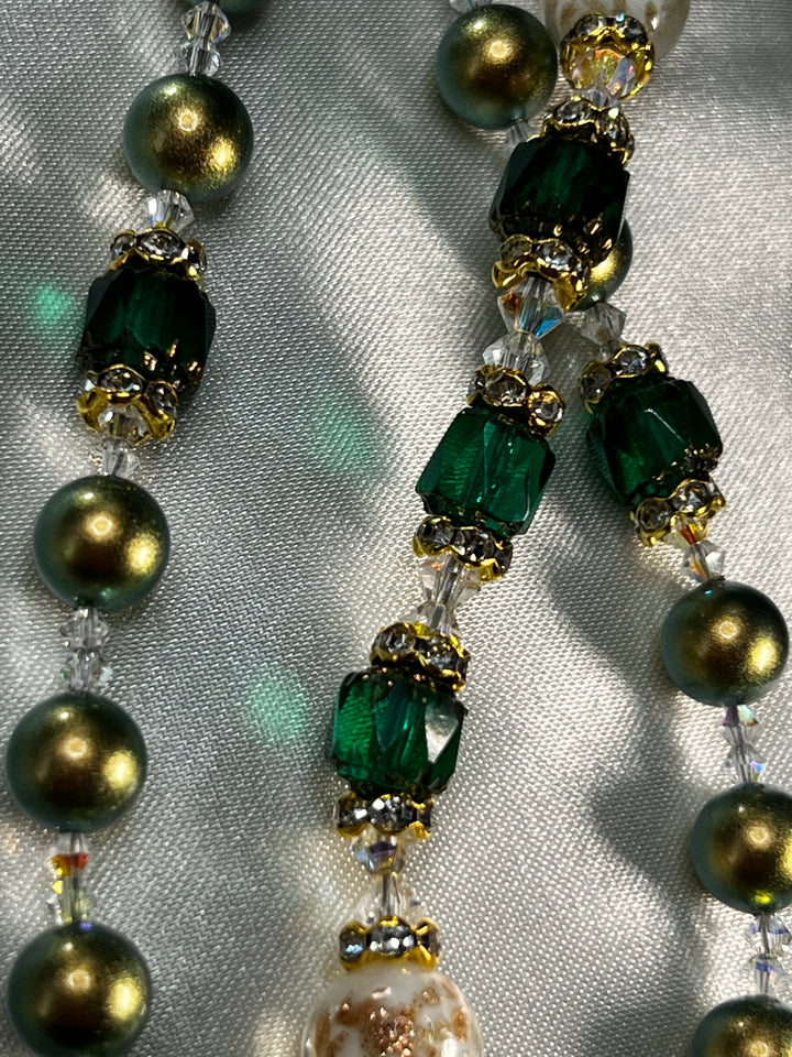 Iridescent Green Swarovski Pearl beads with Emerald Green Cathedral beads & Swarovski Crystal spacers.